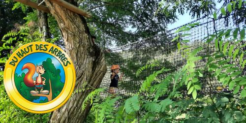 Treetop course with monkey bridges and ziplines at Du Haut des Arbres in La Canourgue